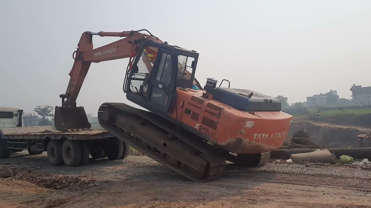 Tata Hitachi 210 Poclane unloading