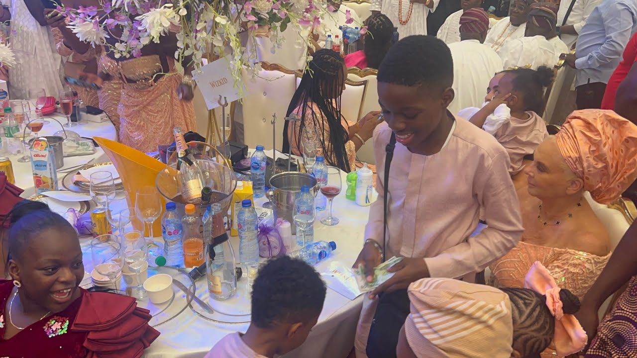 WIZKID FIRST SON BOLUWATIFE RAINED MONEY ON HIS YOUNGER BROTHER AT WIZKID MOM BURIAL