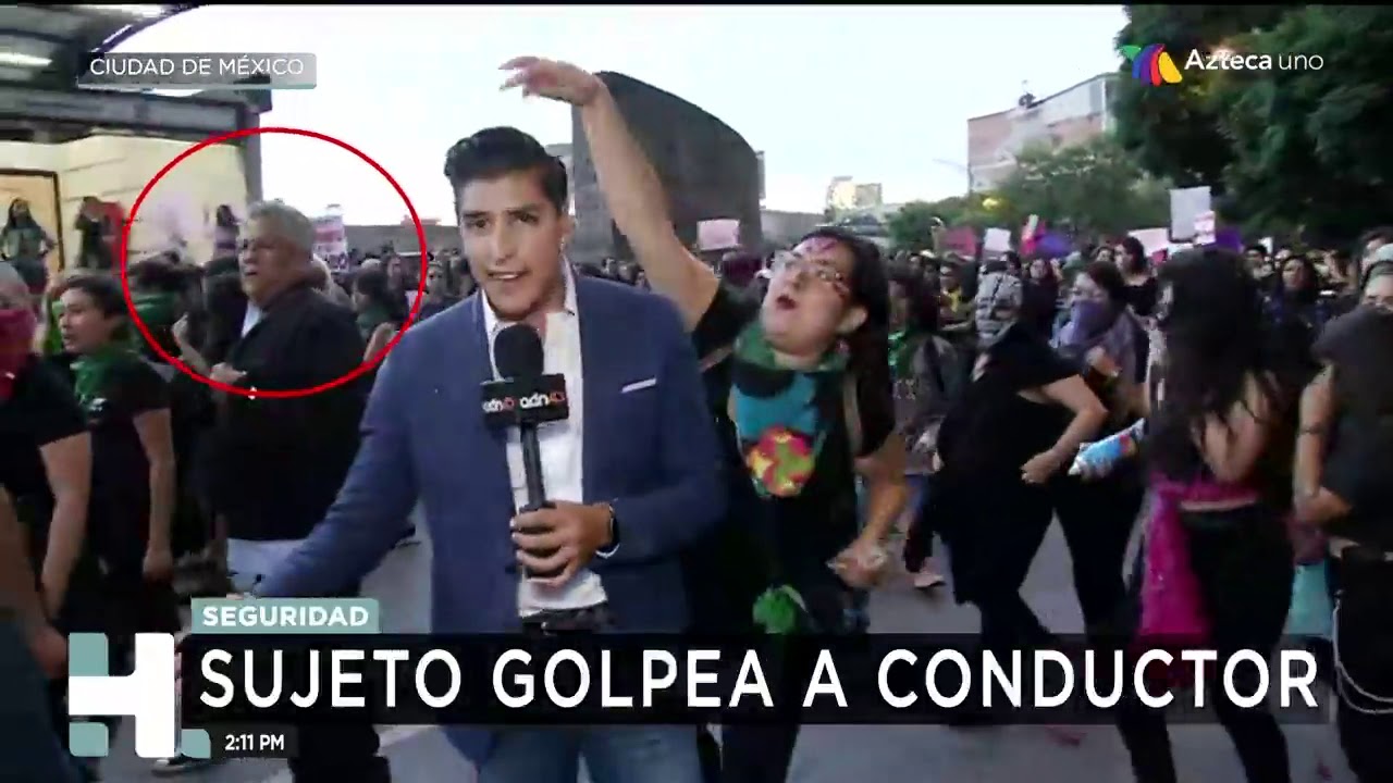 Provocadores golpean a reporteros en marcha contra violencia de género