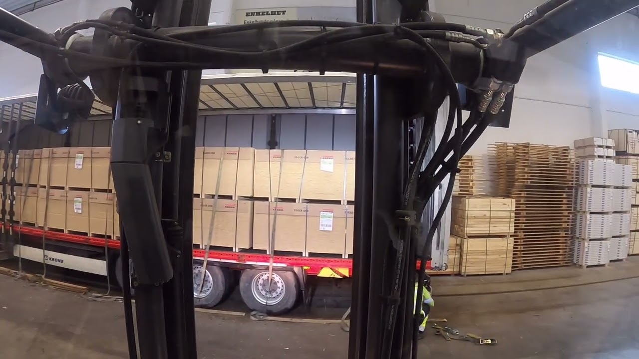 5-ton electric forklift truck POV: Unloading big load of OSB from Germany