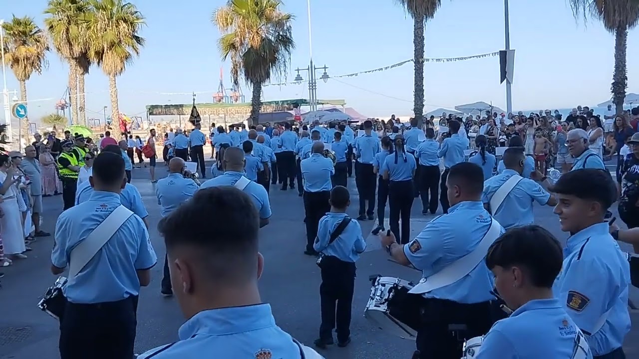Banda de CCTT de Bomberos acompañando a la cruz guía de la Virgen del Carmen de Huelin. Málaga, 2024