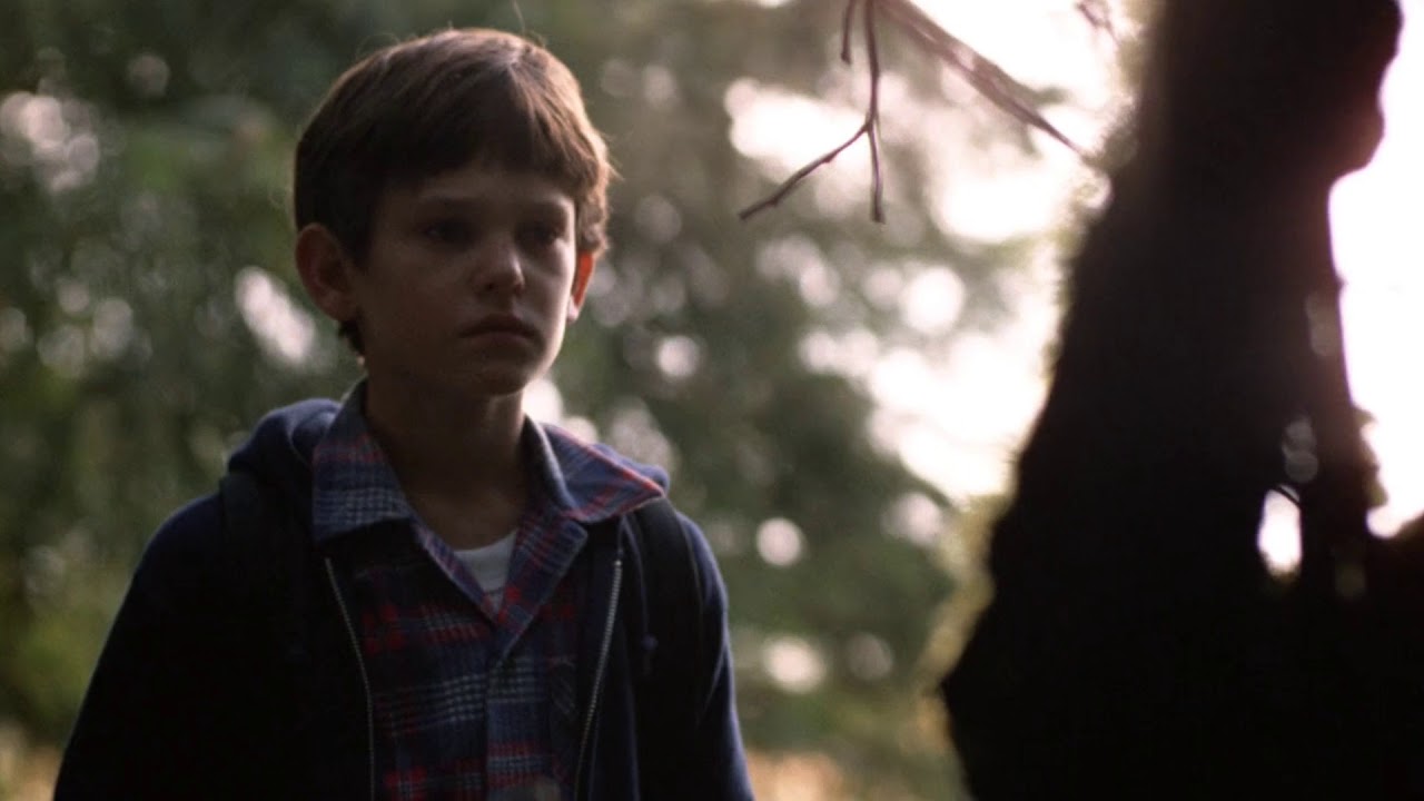 E.T. Elliott looks for E.T in the woods