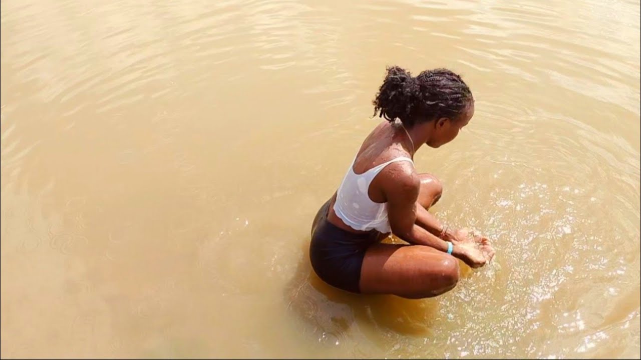 How African Girl Bath In The River