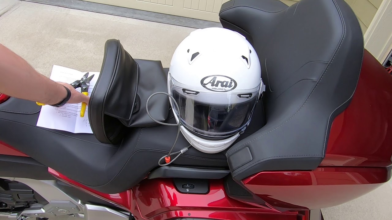 What is the best way to secure a helmet to a motorcycle?