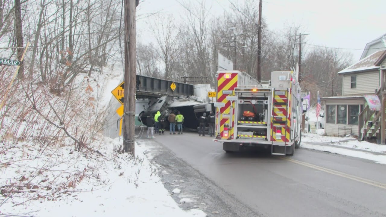Truck roll-over under railroad bridge shuts road down | 28/22 News