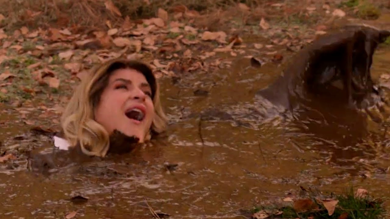 Woman sinks in mud