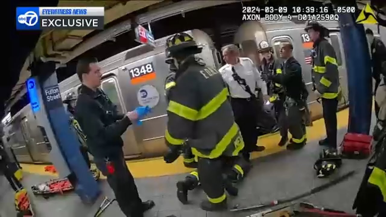 ESU officers rescue woman pushed to subway tracks and hit by train