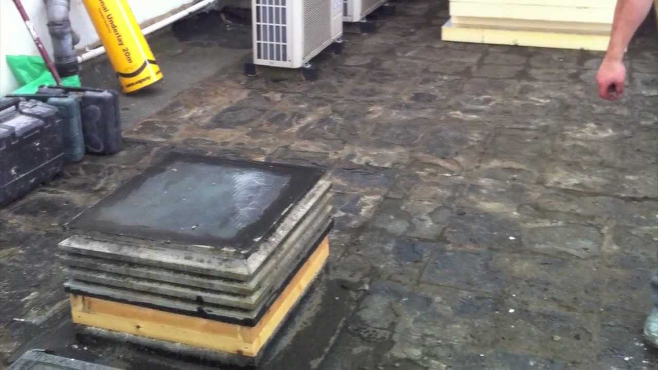 New flat roof over insulation with  promenade tiles Camden NW3