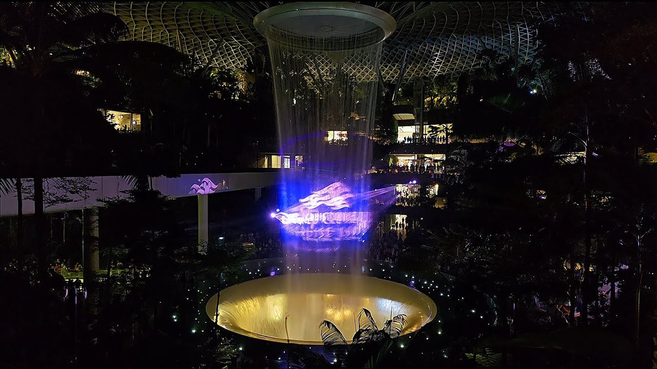 JEWEL Changi Airport Rain Vortex Disney's Magic Adventure Cruise Ship Lights And Music Showcase 9 pm