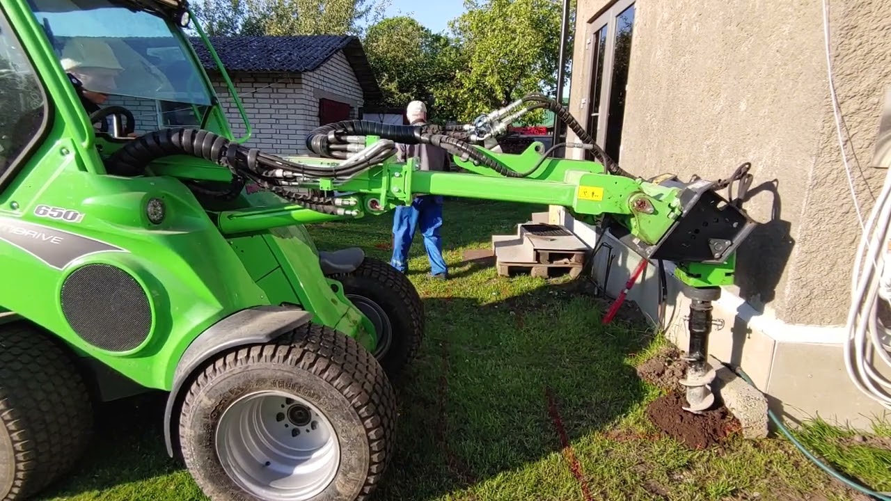 Avant drilling post foundation holes