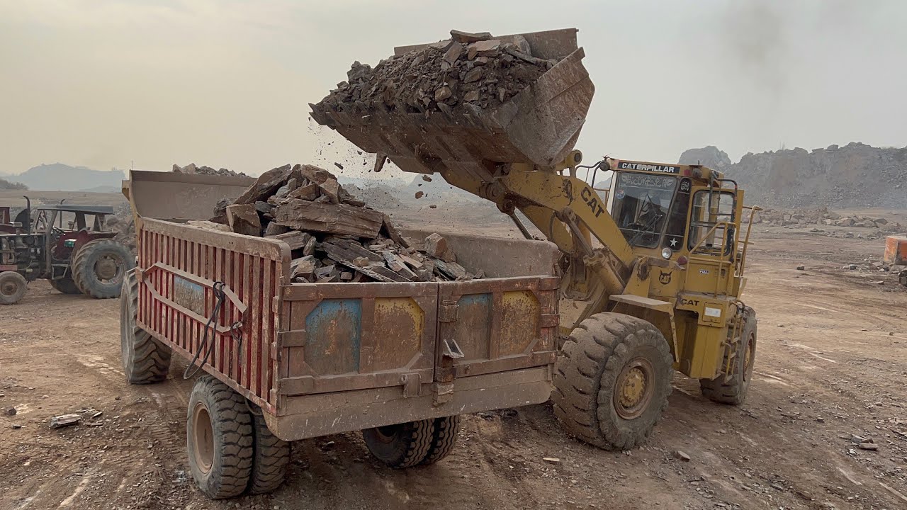 Caterpillar Heavy Equipment Loading Big Rocks into Dumper Trucks | Extreme Work#caterpillar #loader 
