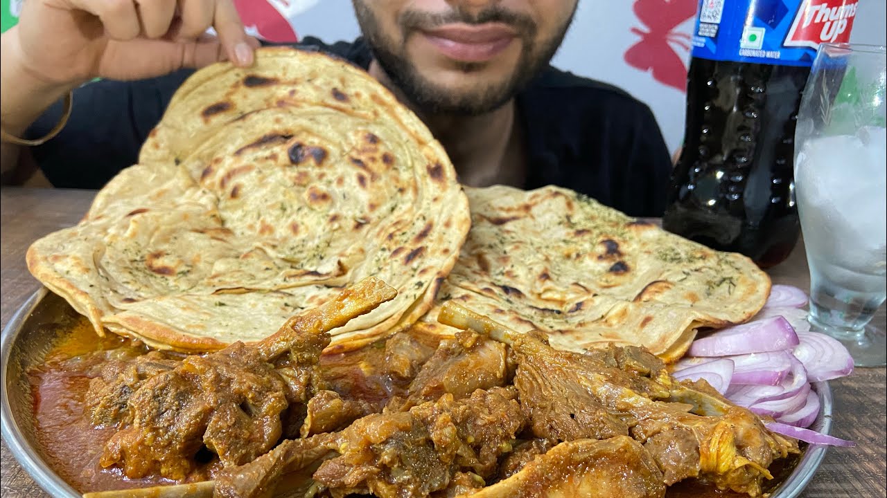 Mutton Curry with lachha Paratha with thumbs up and salad