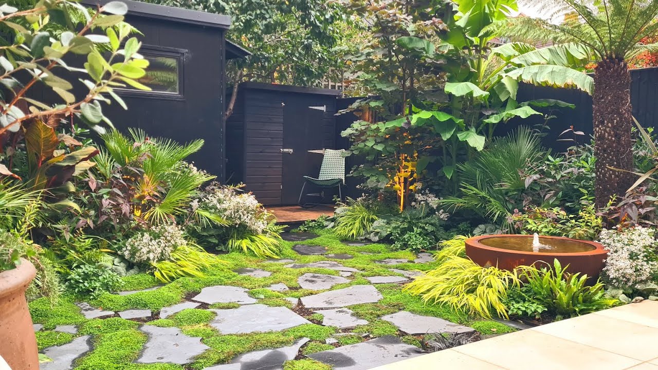 Small, Secluded City Garden with Tropical Planting and Stunning Water Feature in Ealing W13