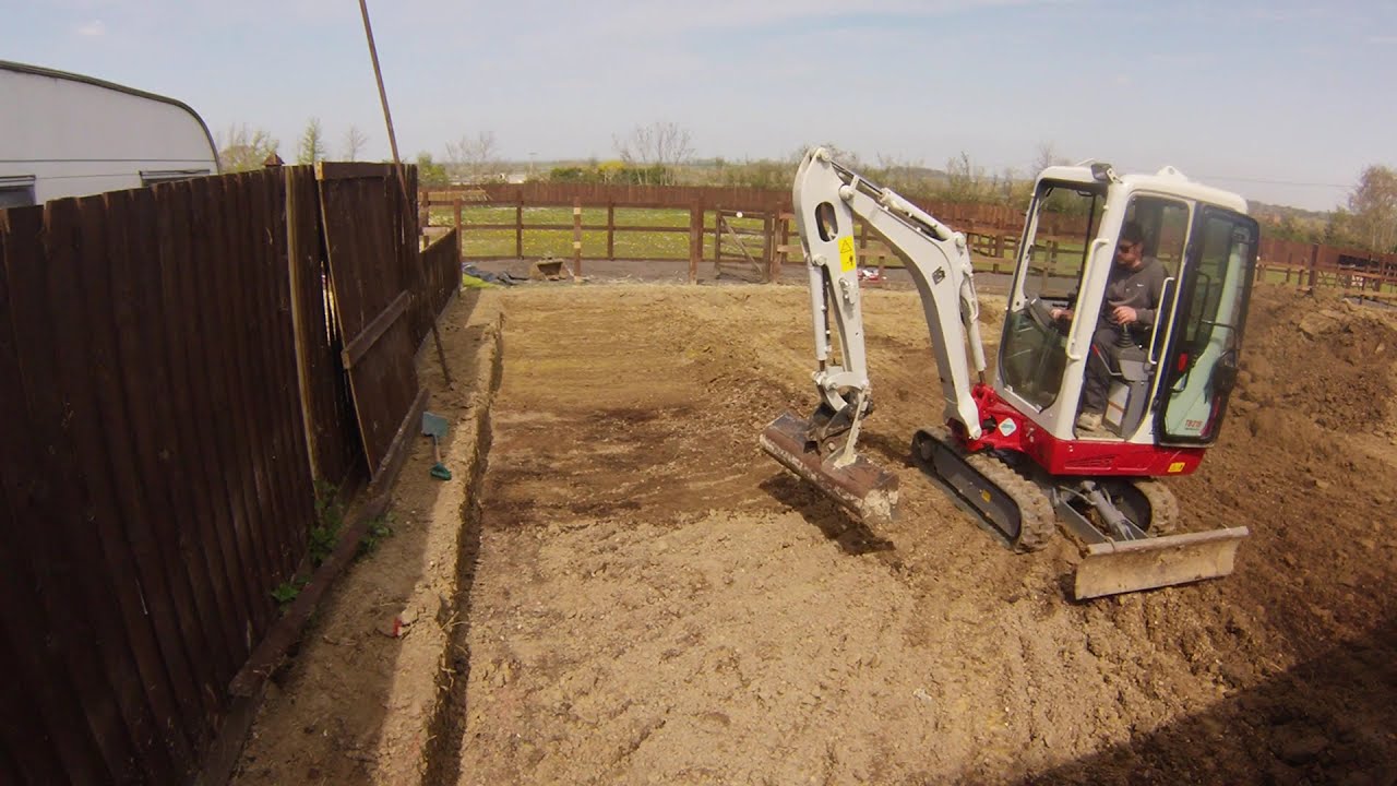 Digging out a base for a stable with a Takeuchi TB216 Digger Excavator