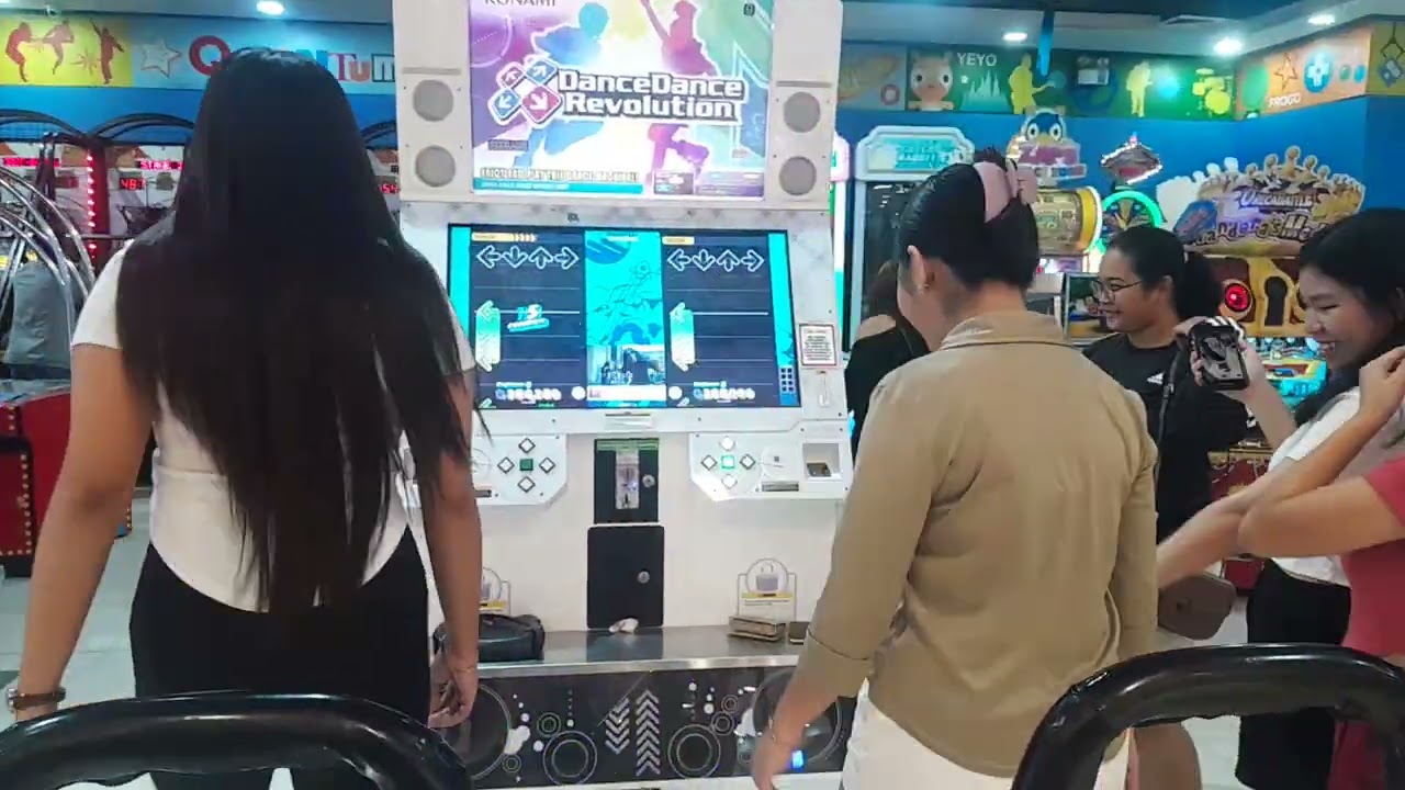 The Girls playing DDR