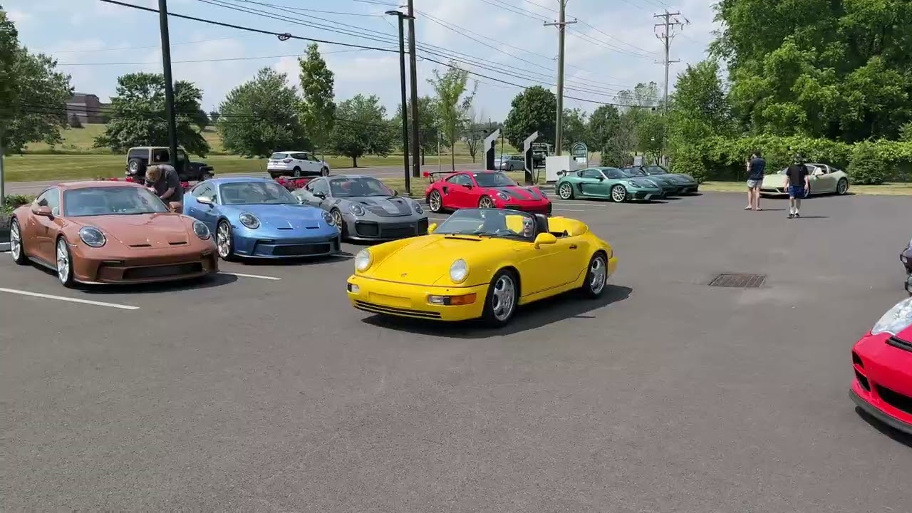 Cars leaving Porsche Warrington's Porsche 75th Anniversary Celebration