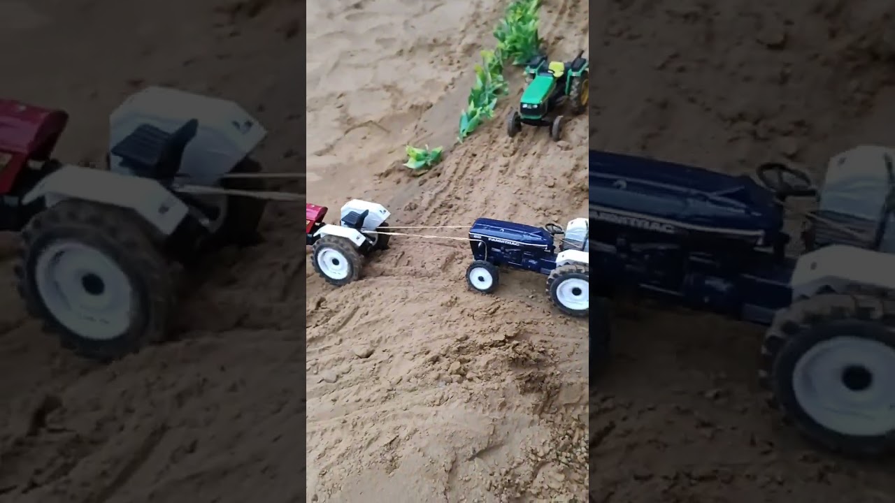 Tractor pulling tractor trolley with JCB loded