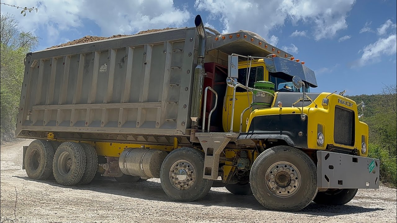 Heavily loaded trucks navigate a steep corner | Shale Mining | S4, E10