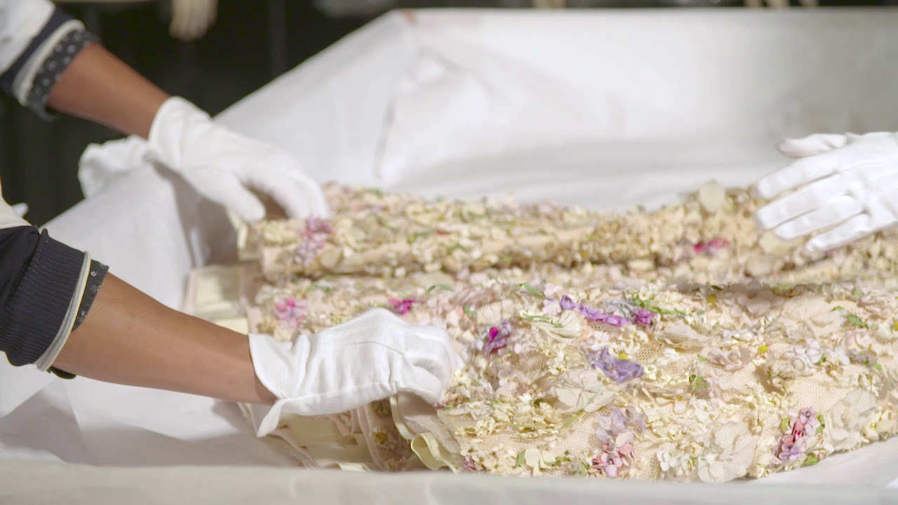 How did the Dior dresses get to the Denver Art Museum?