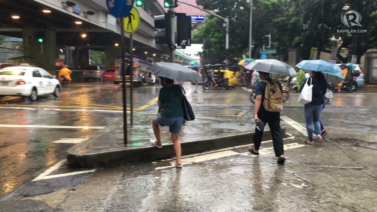 Typhoon Jolina: Commuters brave heavy rains in Manila