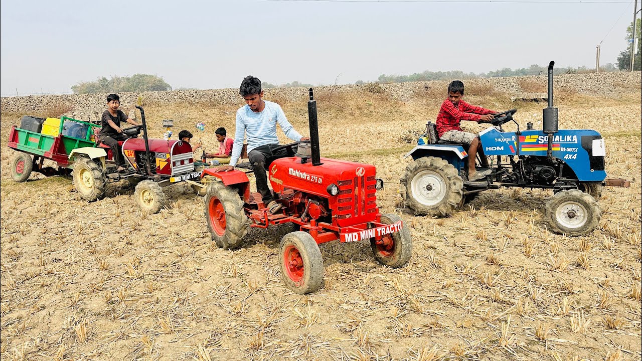 Eicher Tractor is with a Trolley Oil Bucket Stuck in Mud and Mahendra Sonalika Tractor Pulls it 