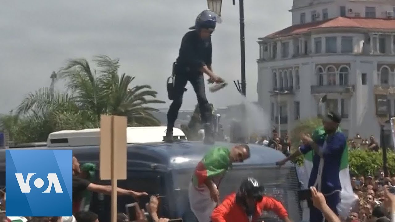 Algeria Police Toppled Off Of Van After Firing Tear Gas At Protesters