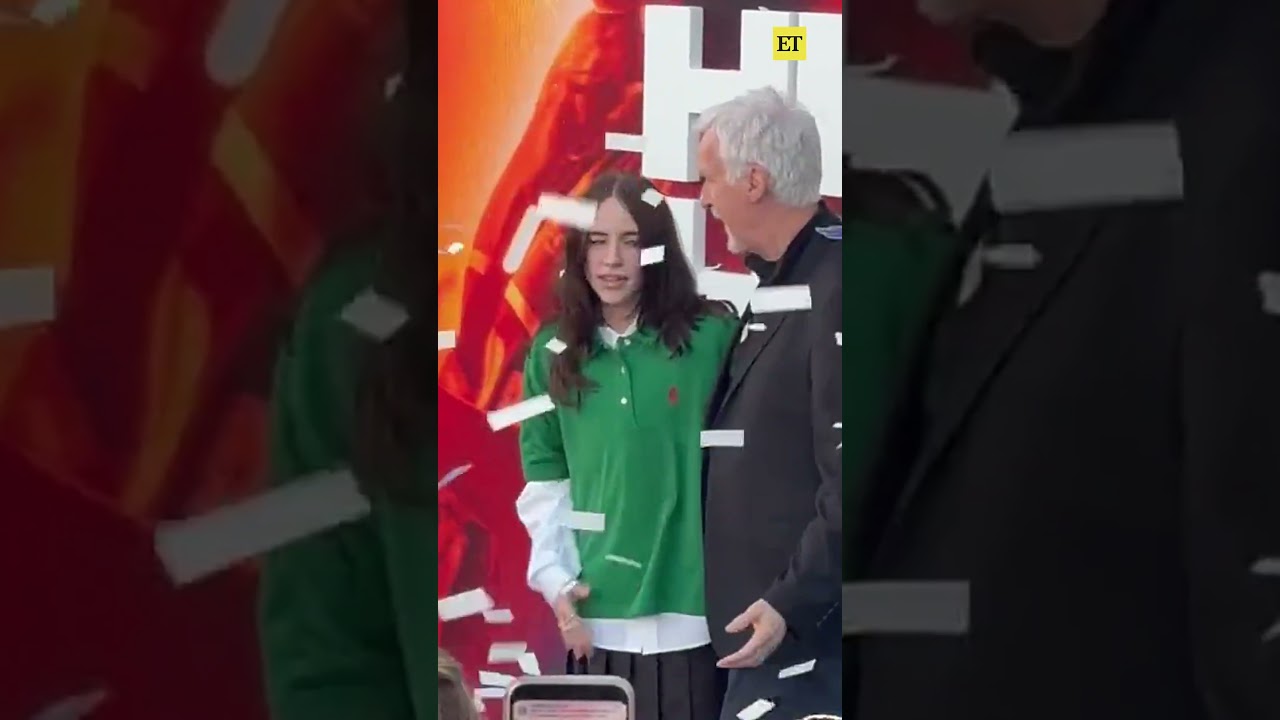 #billieeilish gets startled By confetti cannon at her concert film premiere with #jamescameron 🤣🎊