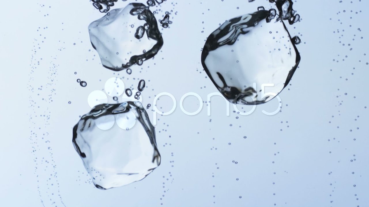Ice Cubes Falling Into Water stock footage