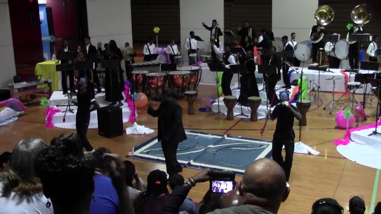 Band Director Phil Crews shows the Drum Majors how to work it