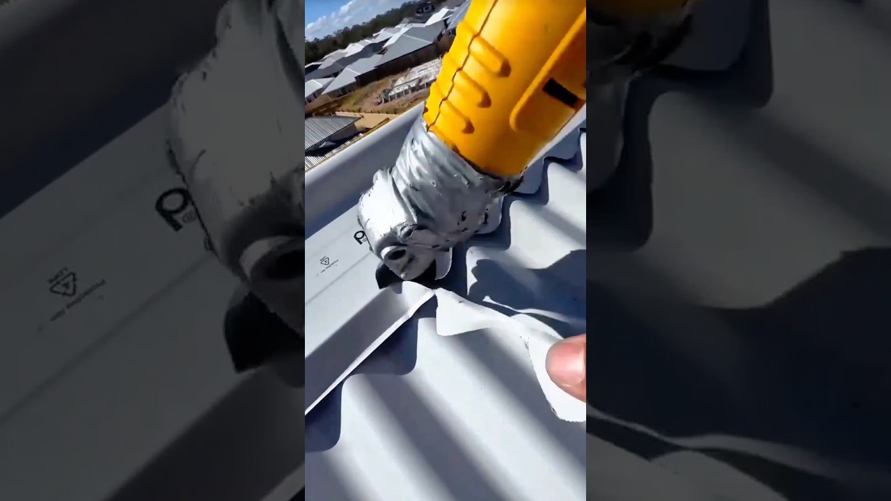 Power Tool Cutting Through Corrugated Metal Roofing Sheet