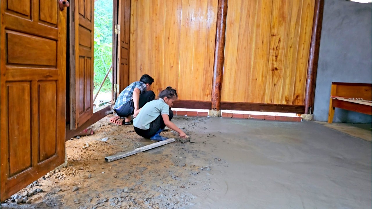 Uncle and Phuong Vy tried to make a concrete foundation for the house when it was pouring rain