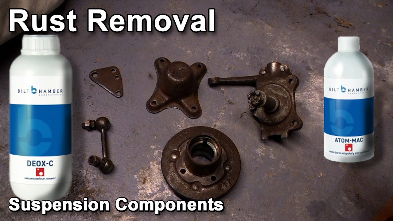 Cleaning the rust off the removed suspension components removed from the MG Midget