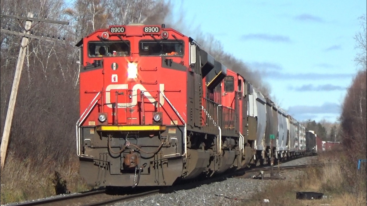 Three Engines Lead a Long Manifest Train CN 507 into Moncton, NB on a Sunny November Afternoon