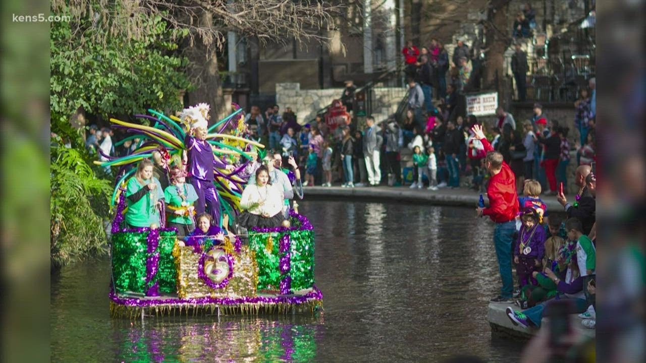 Mardi Gras festival and parade happening on San Antonio River Walk