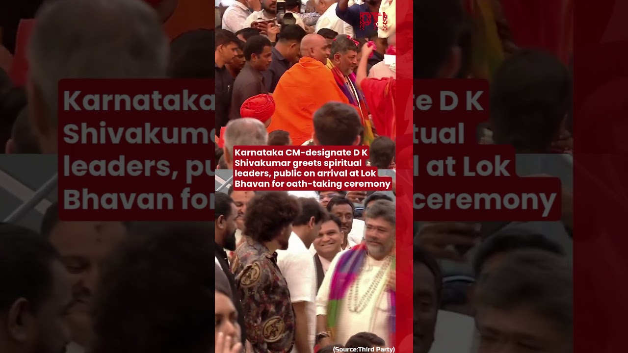D K Shivakumar greets spiritual leaders, public on arrival at Lok Bhavan for oath-taking ceremony