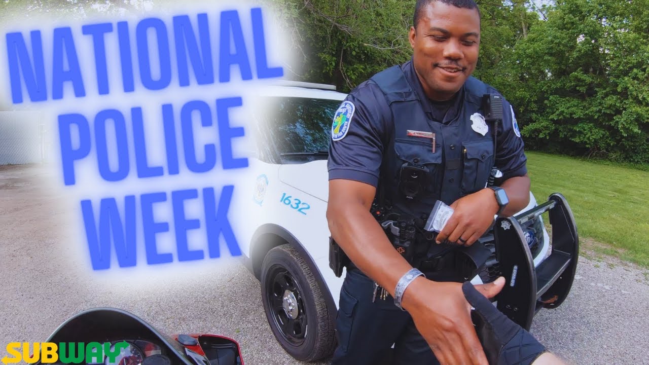 Handing out gift cards to police officers