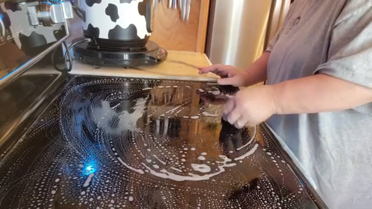Cleaning glass top stove with razor blade