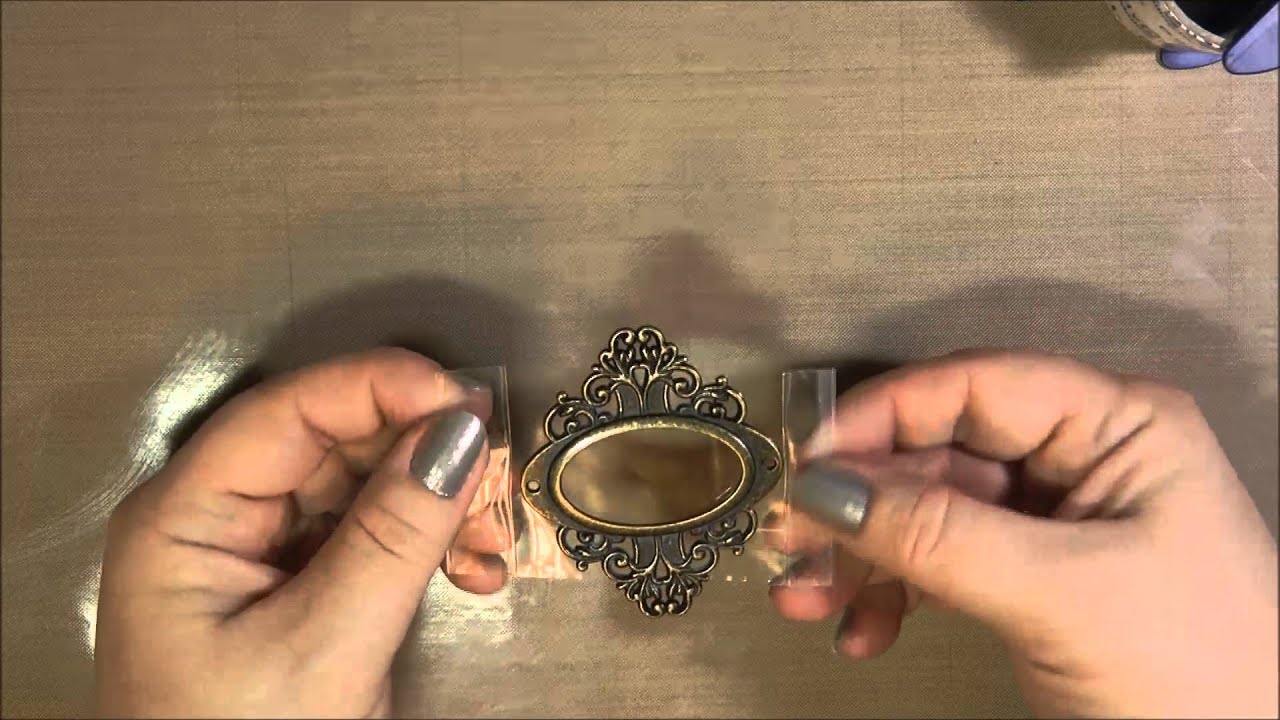 Using ICE Resin, packing tape and a decorative bookplate to create an open back bezel
