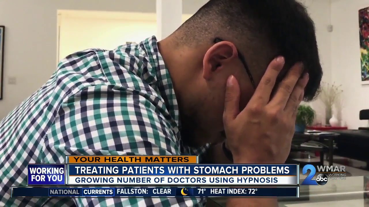 Doctors treating stomach problems with hypnosis