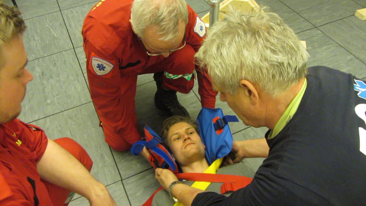 Paramedics at work - Vacuum mattress and Log Roll on to the stiff mattress.