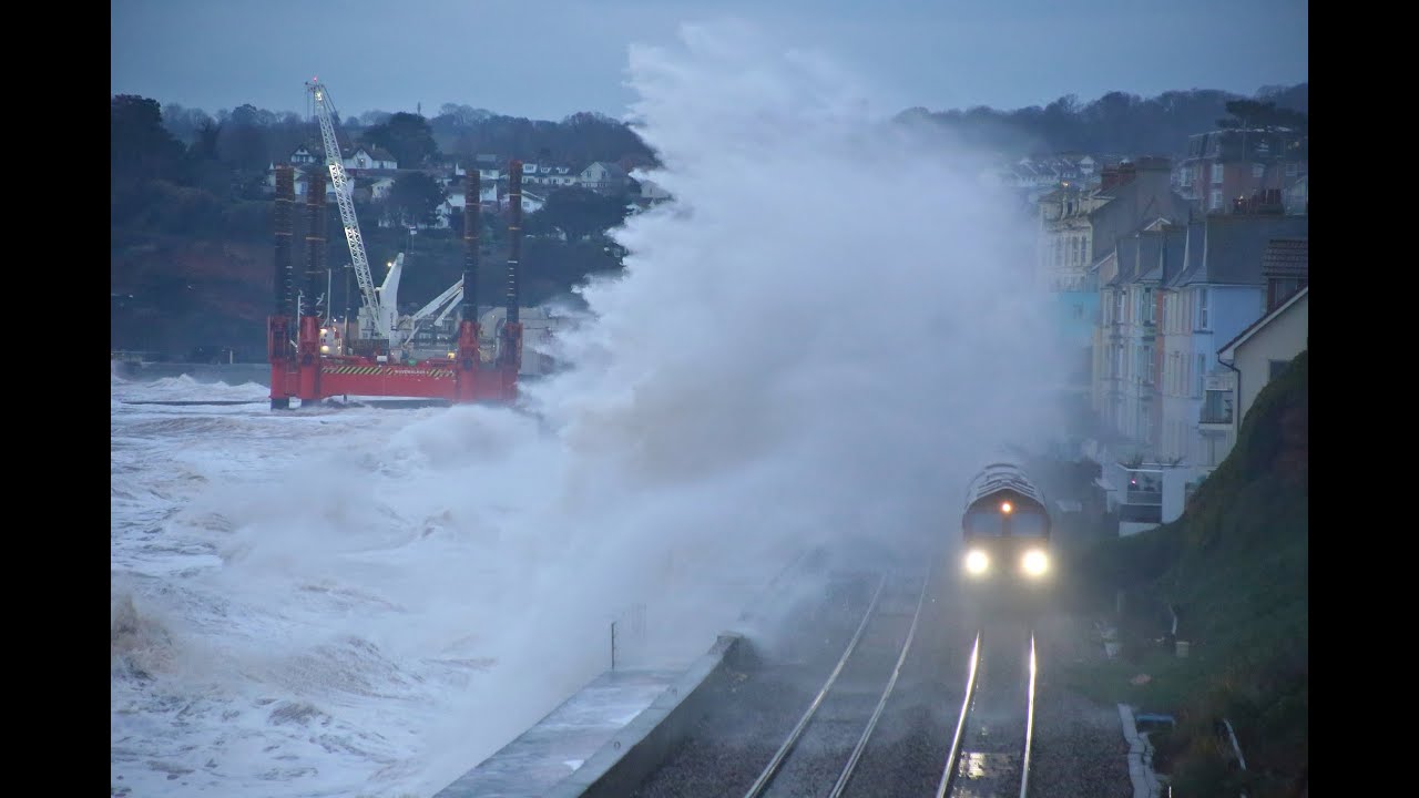Severe Weather with Waves crashing over trains on the Dawlish Sea Wall from Storm Darcy   11/02/21