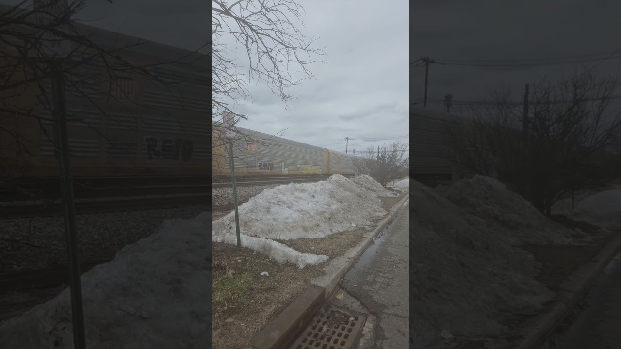 CSX SD70Mac's leading mixed autorack train at Ridgefield Park NJ