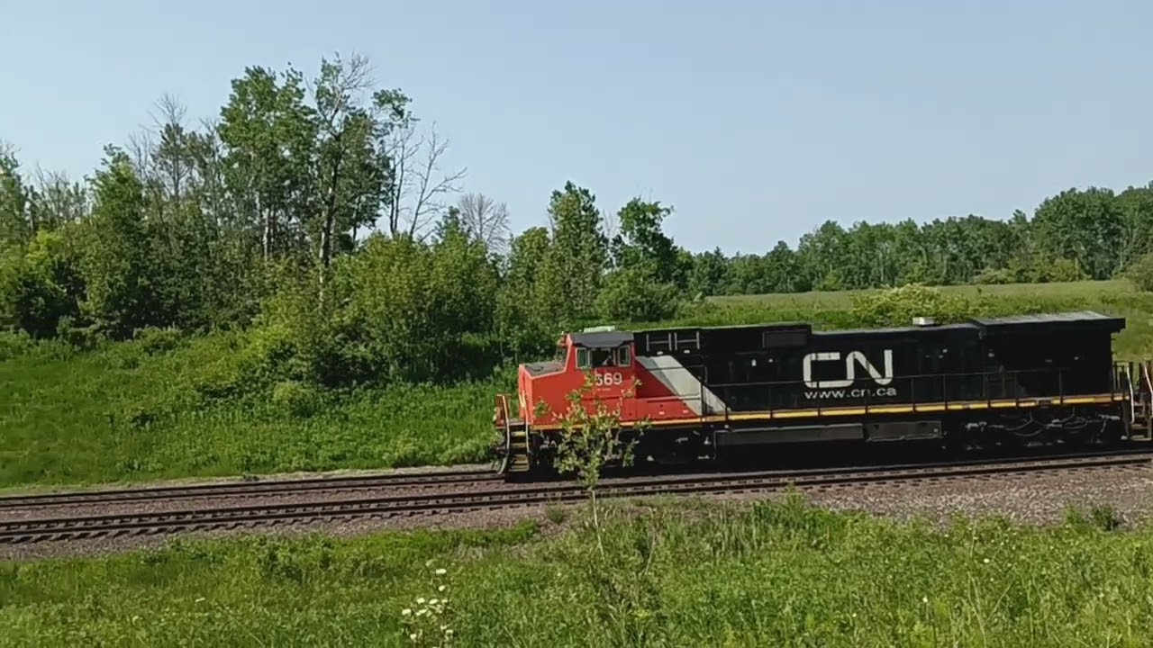 Two CN Dash 9 locomotive 4 train cars