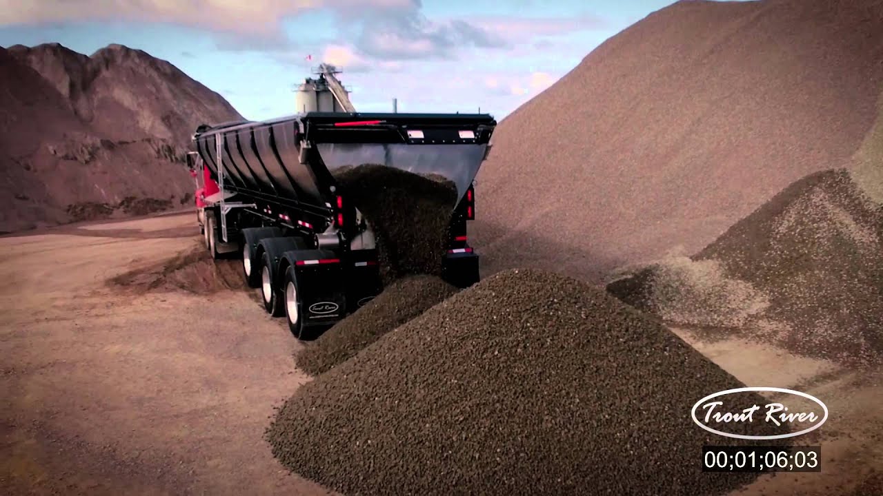 Trout River Live Bottom unloads aggregate in a pit