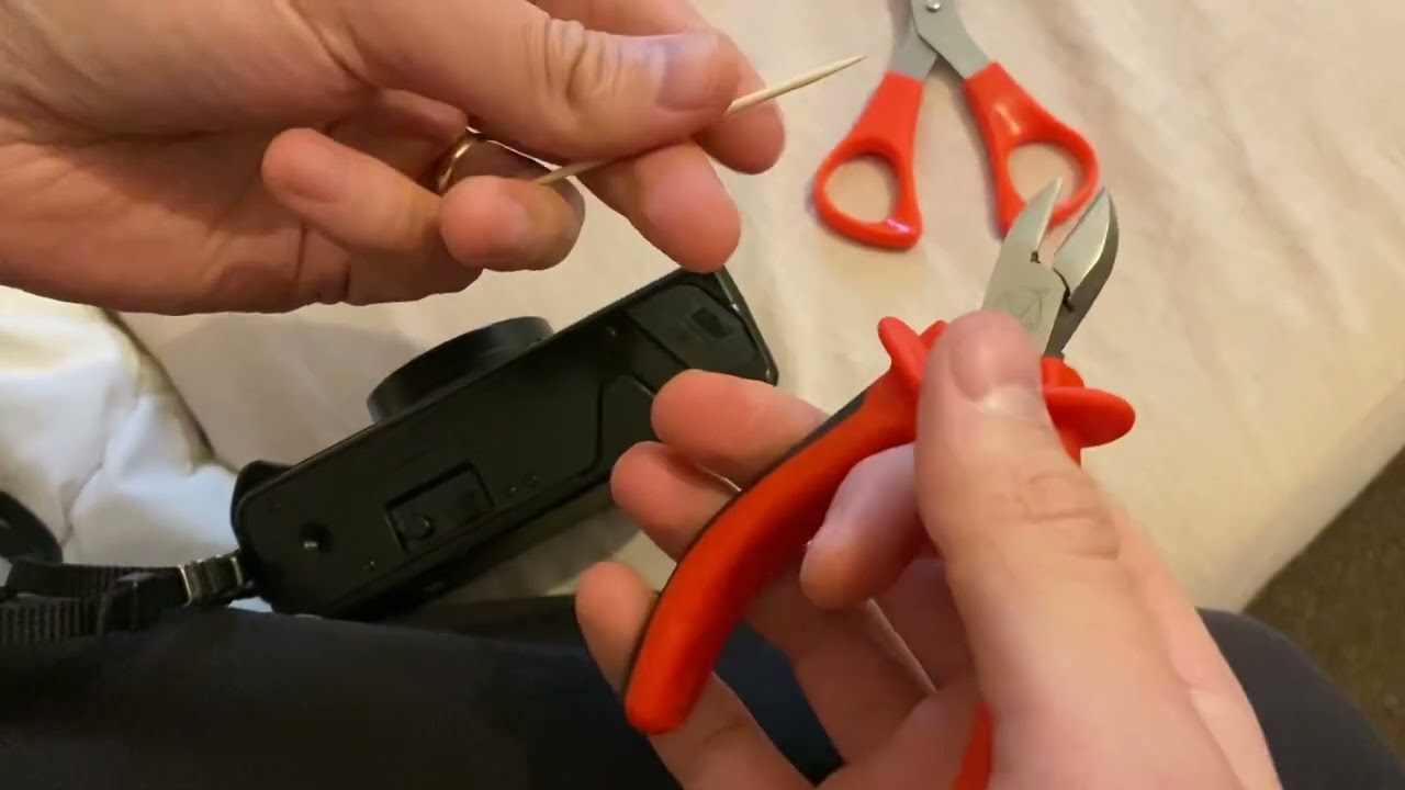 Fix Nikon L35AF loose battery door DIY