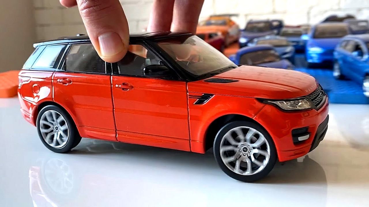We show a collection of orange cars, spin them in our hands