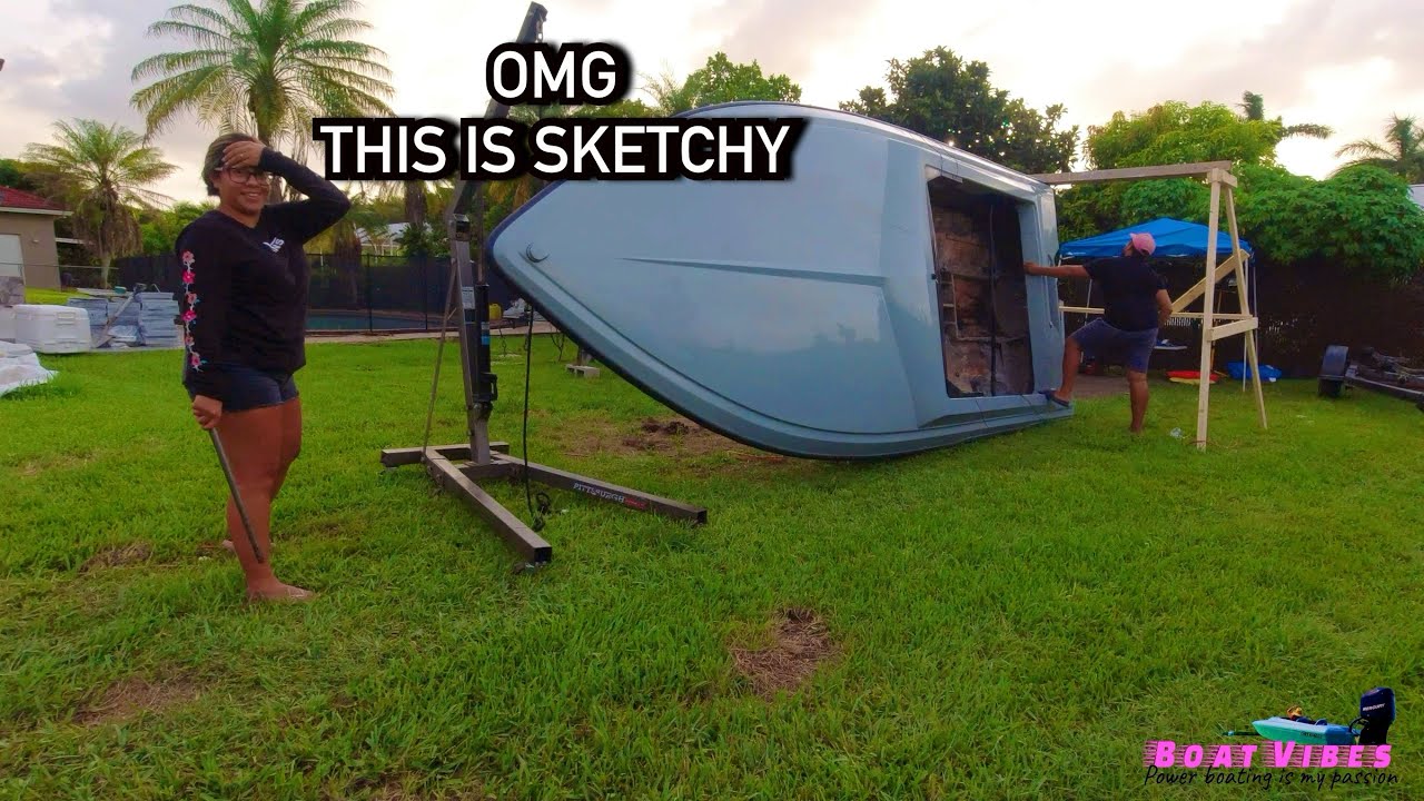 Lifting boat off the trailer and flipping it upside down