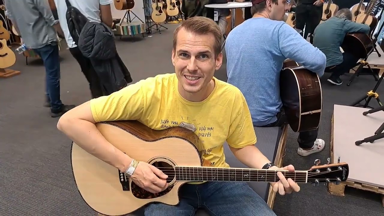 Lukas checking out some Larrivée Guitars at Guitar Summit 2024
