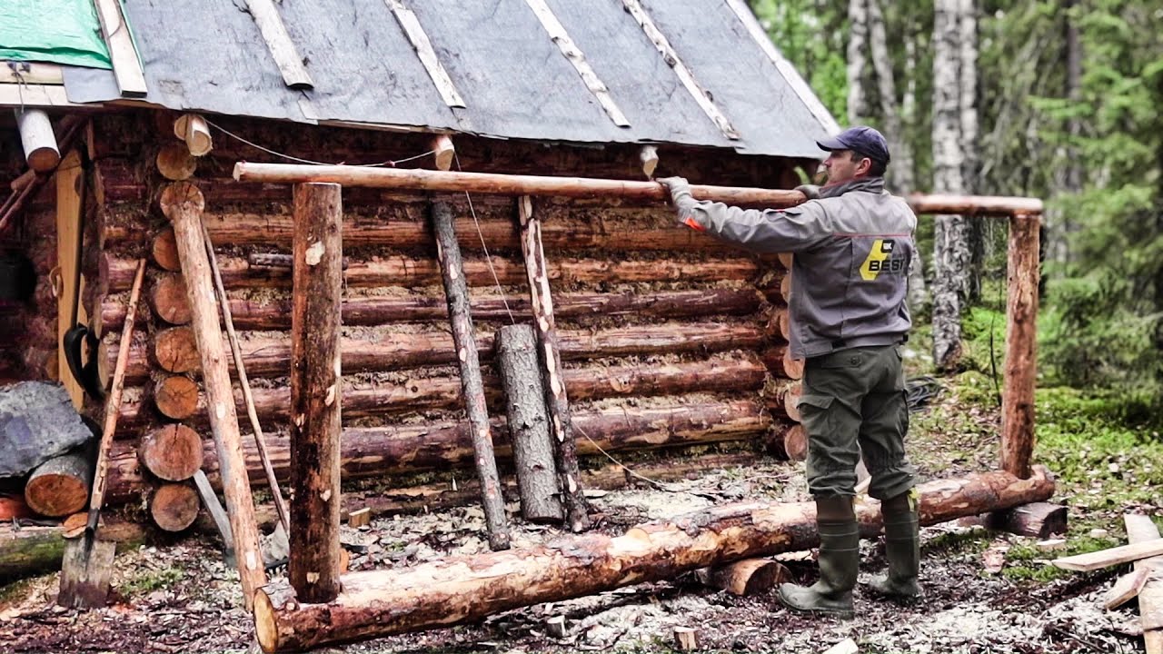 Life in a Log Cabin in a Siberian Forest. Built Firewood Storage