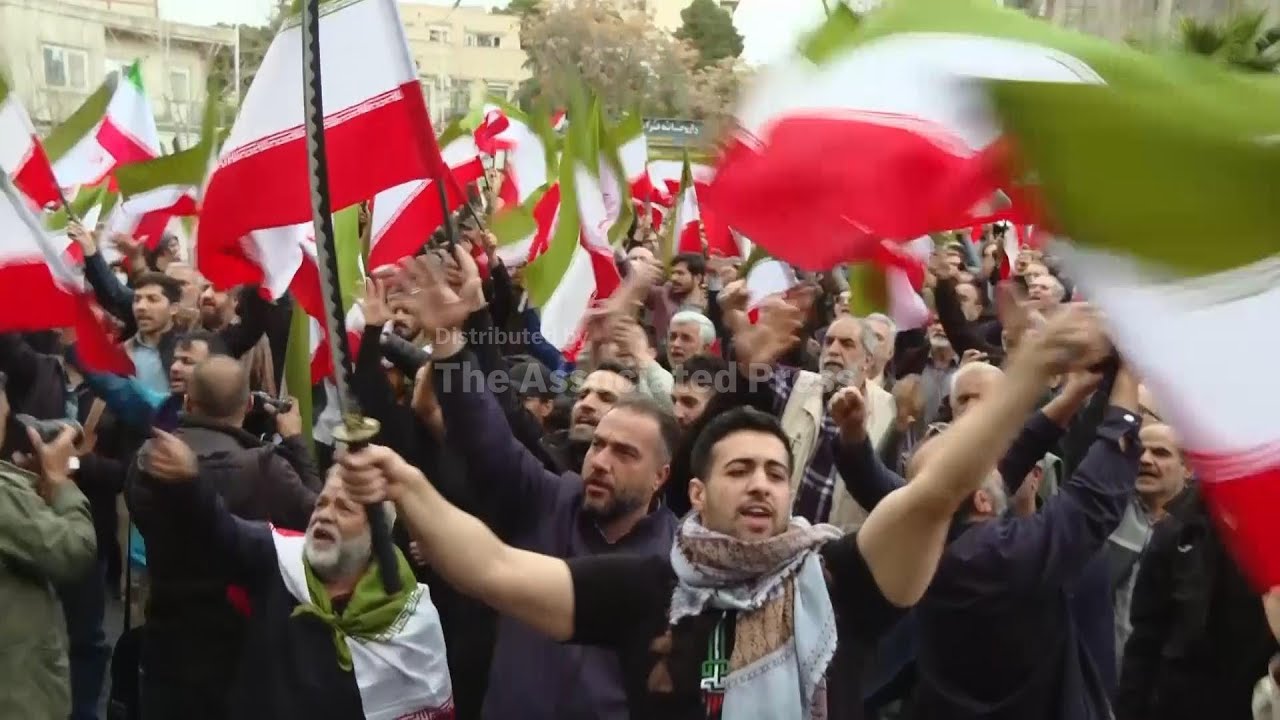 Supporters of Iran government rally in Tehran to protest Israeli and US air strikes